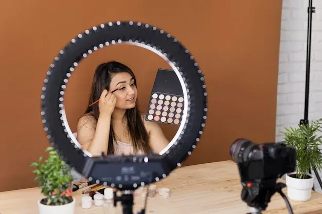 A complete vlogging setup with a camera, microphone, and ring light