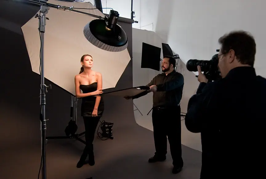 A person filmed with harsh, unflattering overhead room lighting