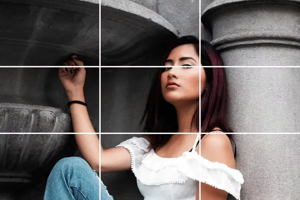 A person composing a shot using the rule of thirds grid on their camera