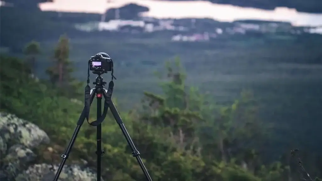 A CreatorKit tripod standing firm on a rocky outdoor surface.