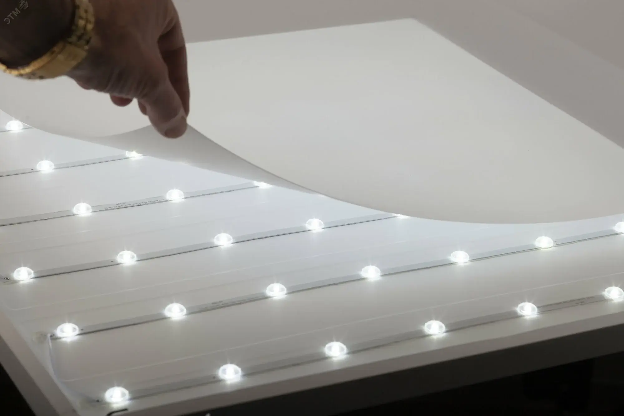 The heat-dissipating aluminum back of an LED panel.