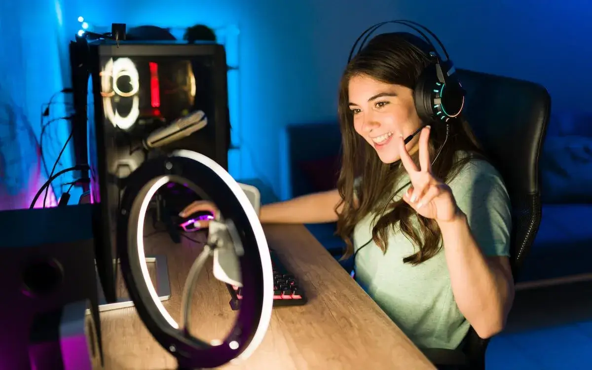 A streamer perfectly lit by a ring light during a gaming session.