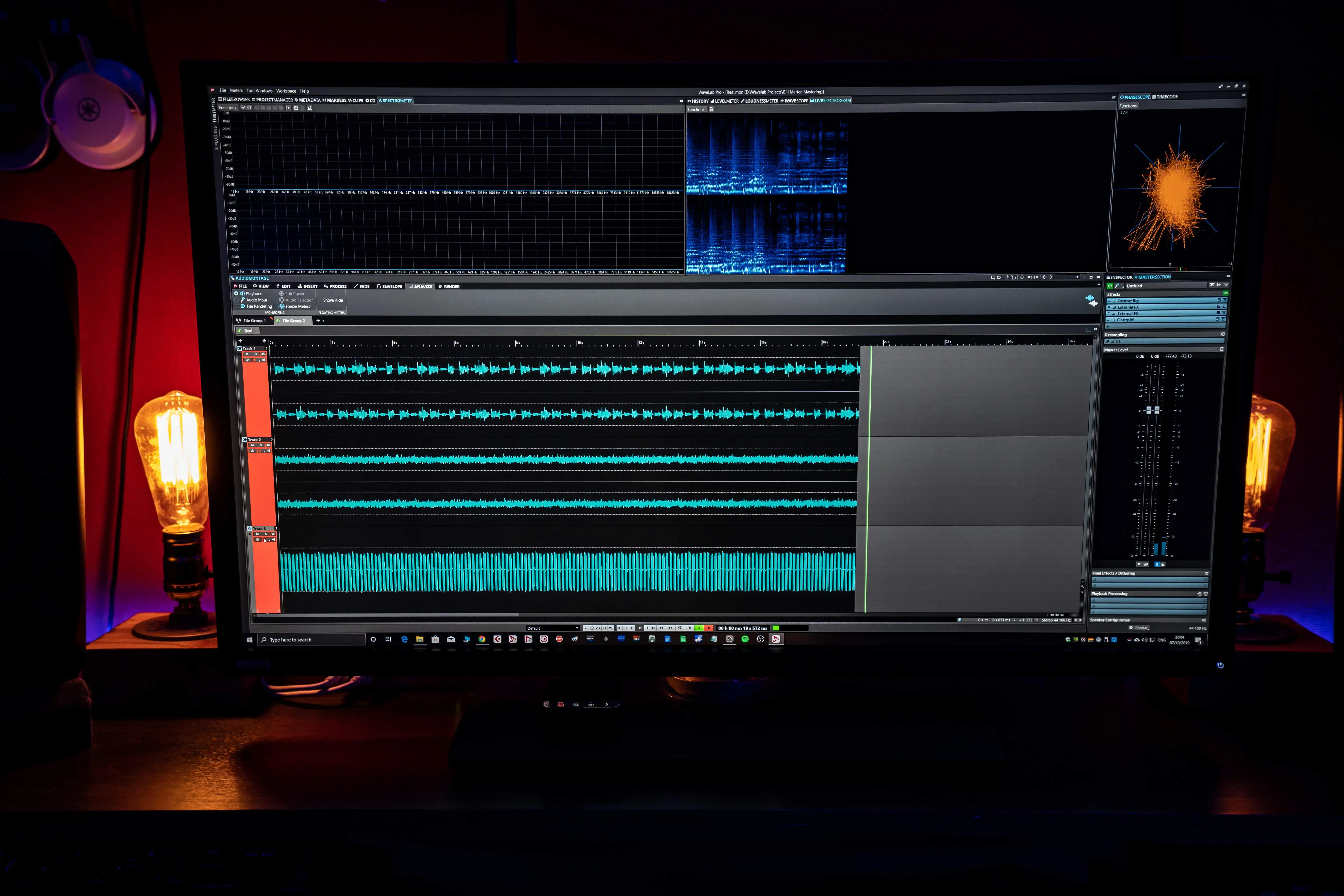 A content creator looking frustrated at a noisy audio waveform in their editing software.