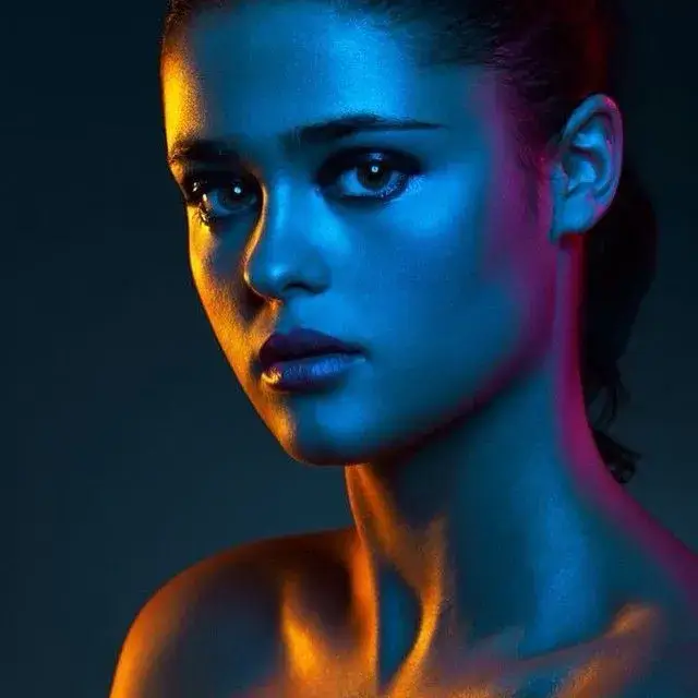 A person's face split to show the difference between hard and soft light.